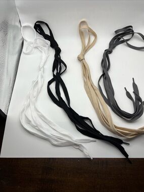 Four pairs of shoe laces.  New.